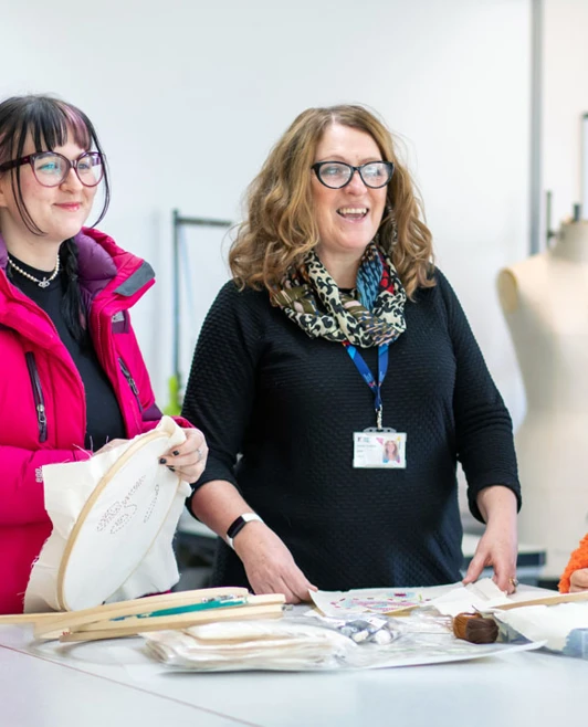 A group of students discussing fashion design projects with their lecturer at Glasgow Kelvin College. A group of students discussing fashion design projects with their lecturer at Glasgow Kelvin College.